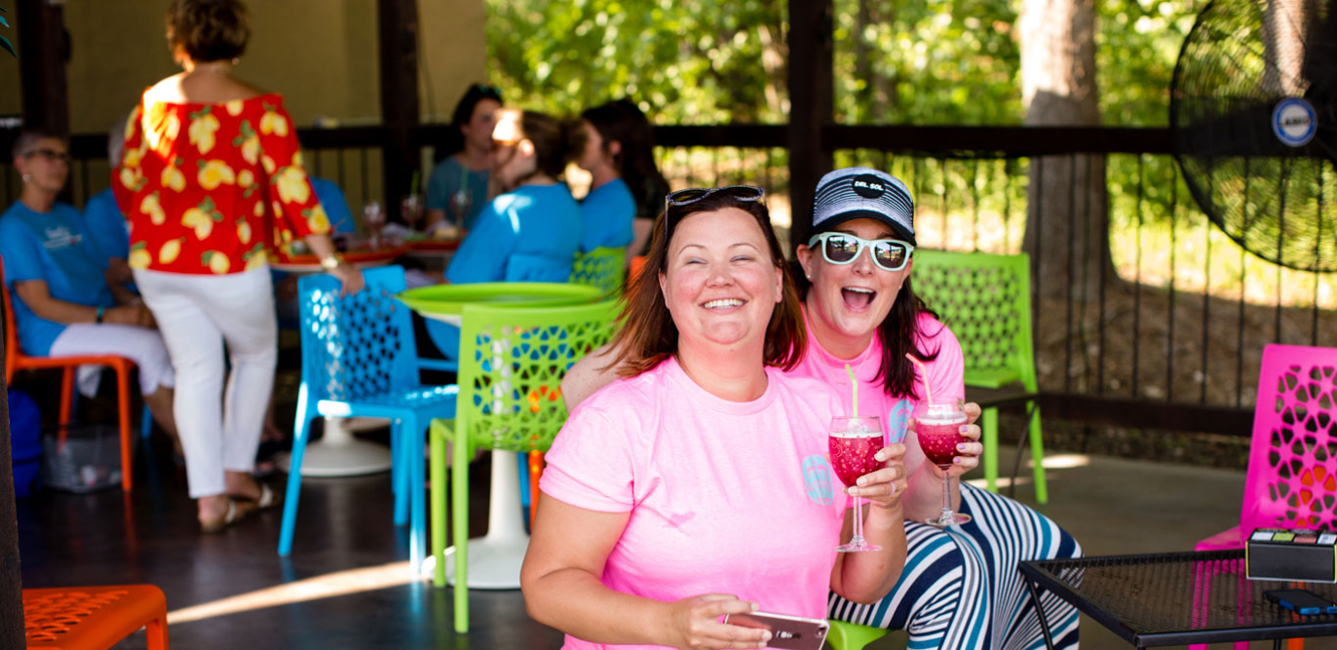 Friends enjoying a Wine-a-rita on the Girls Gone Wine patio